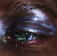 a woman's eye with the words'reality'painted on it